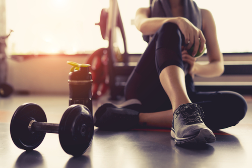 a woman with weights in a gym
